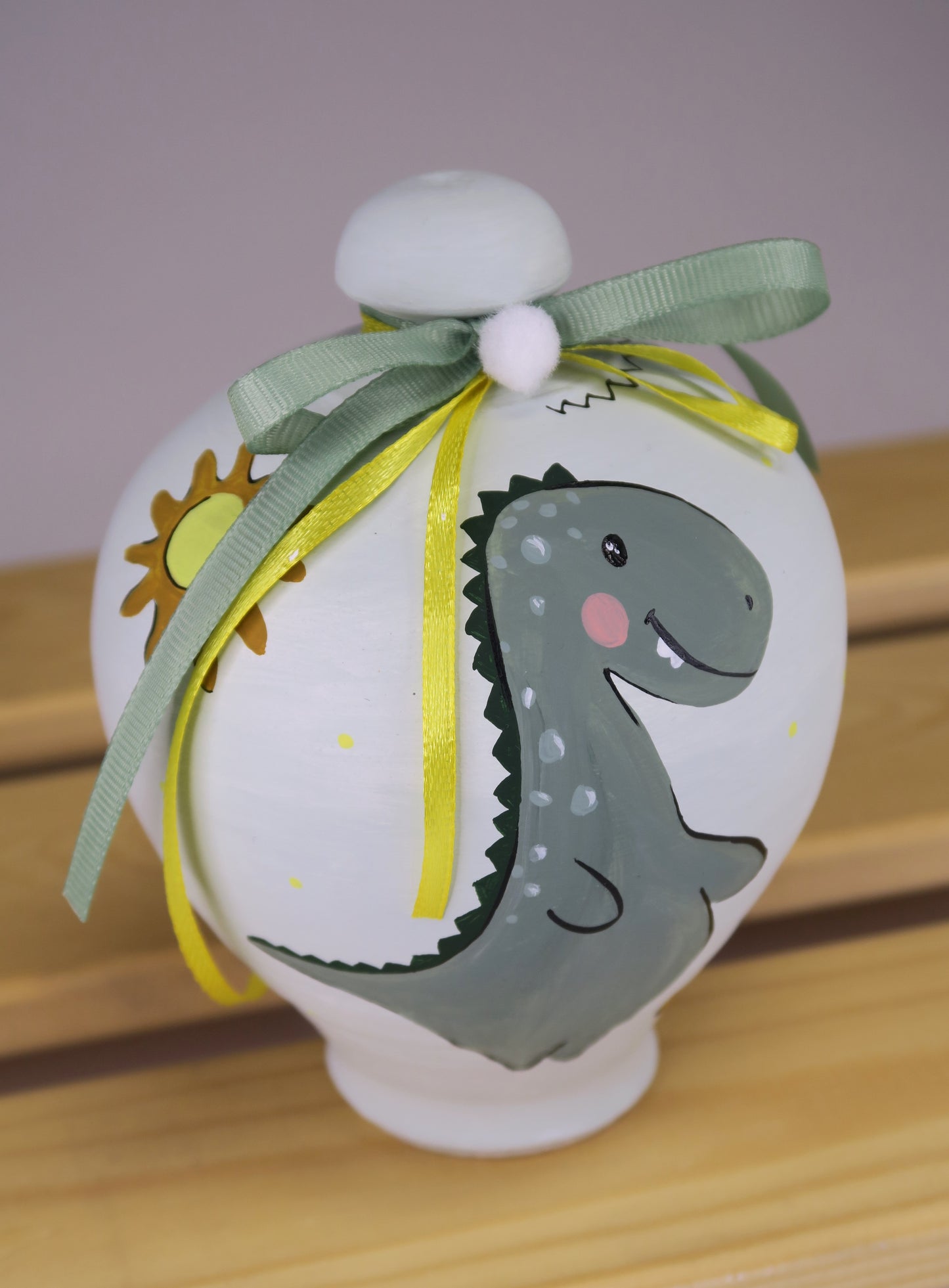 Κουμπαράς Με Δεινόσαυρο